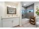 Modern bathroom with a sleek vanity, tub, and stylish tile work at 11416 N Blackheath Rd, Scottsdale, AZ 85254