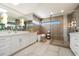 Modern bathroom with dual vanity, spacious shower, and unique sconces providing ample lighting at 11416 N Blackheath Rd, Scottsdale, AZ 85254