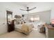 Comfortable bedroom with natural light, ceiling fan, and neutral tones, creating a serene atmosphere at 11416 N Blackheath Rd, Scottsdale, AZ 85254