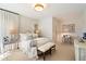 Inviting bedroom with elegant decor, a bench seat, neutral color palette, and abundant natural light at 11416 N Blackheath Rd, Scottsdale, AZ 85254