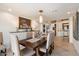 Well-lit dining room features neutral decor, with an adjacent, naturally lit courtyard view at 11416 N Blackheath Rd, Scottsdale, AZ 85254