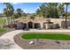 An aerial view showcasing the front of the home, circular driveway, landscaping and palm trees at 11416 N Blackheath Rd, Scottsdale, AZ 85254