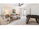 Bright living area with comfortable seating, unique ceiling fan, and open layout to the rest of the home at 11416 N Blackheath Rd, Scottsdale, AZ 85254