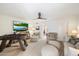 Bright living area with comfortable seating, entertainment center, and foosball table, perfect for entertaining at 11416 N Blackheath Rd, Scottsdale, AZ 85254
