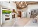 Well-appointed bedroom with vaulted ceilings, fireplace, and backyard views at 11416 N Blackheath Rd, Scottsdale, AZ 85254