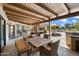 Expansive outdoor living space with comfortable seating and a serene garden view at 11416 N Blackheath Rd, Scottsdale, AZ 85254
