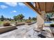 Inviting patio with comfortable seating, manicured landscaping, and scenic golf course views at 11416 N Blackheath Rd, Scottsdale, AZ 85254