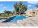 Serene backyard pool offering a private oasis with lush greenery and a tranquil atmosphere at 11416 N Blackheath Rd, Scottsdale, AZ 85254