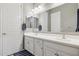 Bathroom featuring a double vanity with white countertops and ample storage cabinets at 11609 W Andrew Ln, Peoria, AZ 85383
