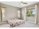 Bright and airy bedroom featuring a comfortable bed and large windows at 11609 W Andrew Ln, Peoria, AZ 85383