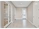 Bright foyer with tile flooring, neutral walls and white doors with multiple entry points at 11609 W Andrew Ln, Peoria, AZ 85383