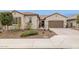 Charming single-story home featuring a well-manicured front yard and a two-car garage at 11609 W Andrew Ln, Peoria, AZ 85383