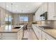 Well-equipped kitchen with a large island, stylish pendant lighting, and views of the backyard at 11609 W Andrew Ln, Peoria, AZ 85383