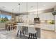 Modern kitchen with a spacious island, stainless steel appliances, and pendant lighting at 11609 W Andrew Ln, Peoria, AZ 85383