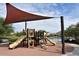 Community playground featuring modern equipment, shade, and a soft landing surface at 11609 W Andrew Ln, Peoria, AZ 85383