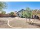 Spacious backyard featuring desert landscaping and mature trees at 11988 W Nadine Way, Peoria, AZ 85383