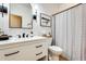 Well-lit bathroom with modern fixtures, white vanity, and stylish mirror at 11988 W Nadine Way, Peoria, AZ 85383