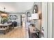 Welcoming entryway leading to an open-concept dining area with stylish furniture and tile flooring at 11988 W Nadine Way, Peoria, AZ 85383