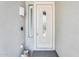 Elegant front door with decorative glass panel and side window, adding curb appeal and letting in natural light at 11988 W Nadine Way, Peoria, AZ 85383