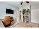 Spacious home office featuring a desk, bookcase, and television for work or entertainment at 11988 W Nadine Way, Peoria, AZ 85383