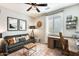 Functional home office with a wooden desk, comfortable seating, and organized workspace at 11988 W Nadine Way, Peoria, AZ 85383