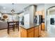 A kitchen with stainless steel appliances, a center island, and a bar table with chairs for casual dining at 11988 W Nadine Way, Peoria, AZ 85383