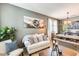 Cozy living room featuring a comfortable sofa, stylish decor, and bright natural light at 11988 W Nadine Way, Peoria, AZ 85383