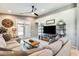Inviting living room featuring a plush sectional sofa, stylish furnishings, and plenty of natural light at 11988 W Nadine Way, Peoria, AZ 85383