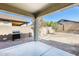 Covered patio area with built in grill in the backyard at 11988 W Nadine Way, Peoria, AZ 85383