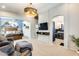 Spacious sitting room showcasing an open layout, seamlessly connecting to the bedroom and bathroom at 11988 W Nadine Way, Peoria, AZ 85383
