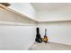 Spacious walk-in closet with ample shelving and guitars on the floor at 11988 W Nadine Way, Peoria, AZ 85383
