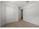 Comfortable bedroom featuring carpeted floors and a closet with sliding doors at 12366 W Marguerite Ave, Avondale, AZ 85323