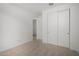 Bright bedroom featuring carpeted floors and a closet with sliding doors at 12366 W Marguerite Ave, Avondale, AZ 85323