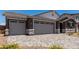 This beautiful home features a spacious three-car garage with a stylish stone and stucco exterior at 12366 W Marguerite Ave, Avondale, AZ 85323