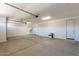 Spacious two car garage with epoxy flooring and white walls at 12366 W Marguerite Ave, Avondale, AZ 85323