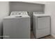 Laundry room with new, full-sized washer and dryer units at 12366 W Marguerite Ave, Avondale, AZ 85323