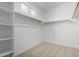 Bright, spacious walk-in closet with shelving and ample hanging space at 12366 W Marguerite Ave, Avondale, AZ 85323