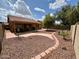 Expansive backyard featuring desert landscaping, pavers, and privacy fence at 1314 W Kingbird Dr, Chandler, AZ 85286
