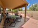 Covered patio with an outdoor dining set, perfect for entertaining or relaxing at 1314 W Kingbird Dr, Chandler, AZ 85286