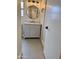 Bathroom features a gray vanity, modern lighting, a framed mirror, and white trim at 1314 W Kingbird Dr, Chandler, AZ 85286
