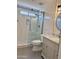 Bathroom features white tile, a glass shower, gray vanity, and modern lighting at 1314 W Kingbird Dr, Chandler, AZ 85286