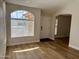 Bright entryway boasts wood flooring, an arched window, and neutral paint for a welcoming feel at 1314 W Kingbird Dr, Chandler, AZ 85286