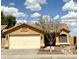 Charming single-story home featuring a well-manicured yard and a two-car garage at 1314 W Kingbird Dr, Chandler, AZ 85286
