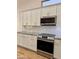 Bright kitchen showcasing modern appliances, granite countertops, and clean white cabinetry at 1314 W Kingbird Dr, Chandler, AZ 85286