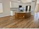 Contemporary kitchen featuring a large island with wood accents and granite countertops at 1314 W Kingbird Dr, Chandler, AZ 85286