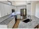 Modern kitchen featuring stainless steel appliances, granite countertops, and stylish cabinetry at 1314 W Kingbird Dr, Chandler, AZ 85286
