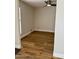 Room with laminate wood floors, neutral walls, and a bright window with a white frame at 1314 W Kingbird Dr, Chandler, AZ 85286