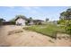 Spacious backyard featuring a covered patio, fire pit, and ample room for outdoor activities and entertaining at 13419 N 35Th St, Phoenix, AZ 85032