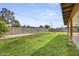Spacious backyard with green grass, block wall, and clear blue sky at 13419 N 35Th St, Phoenix, AZ 85032