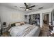 Bedroom features an organized walk-in closet, ceiling fan, and neutral decor at 13419 N 35Th St, Phoenix, AZ 85032